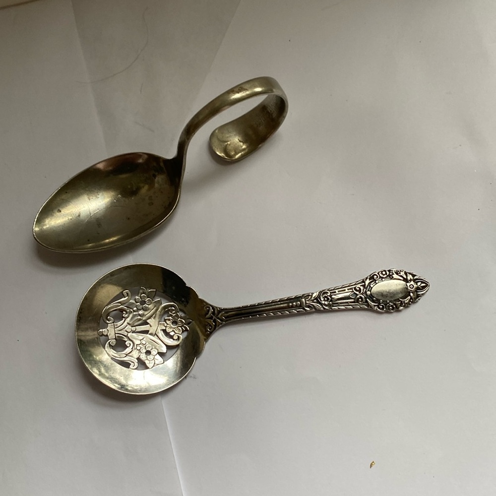 2 pieces of silver plate.  Small child’s spoon. And flat server.